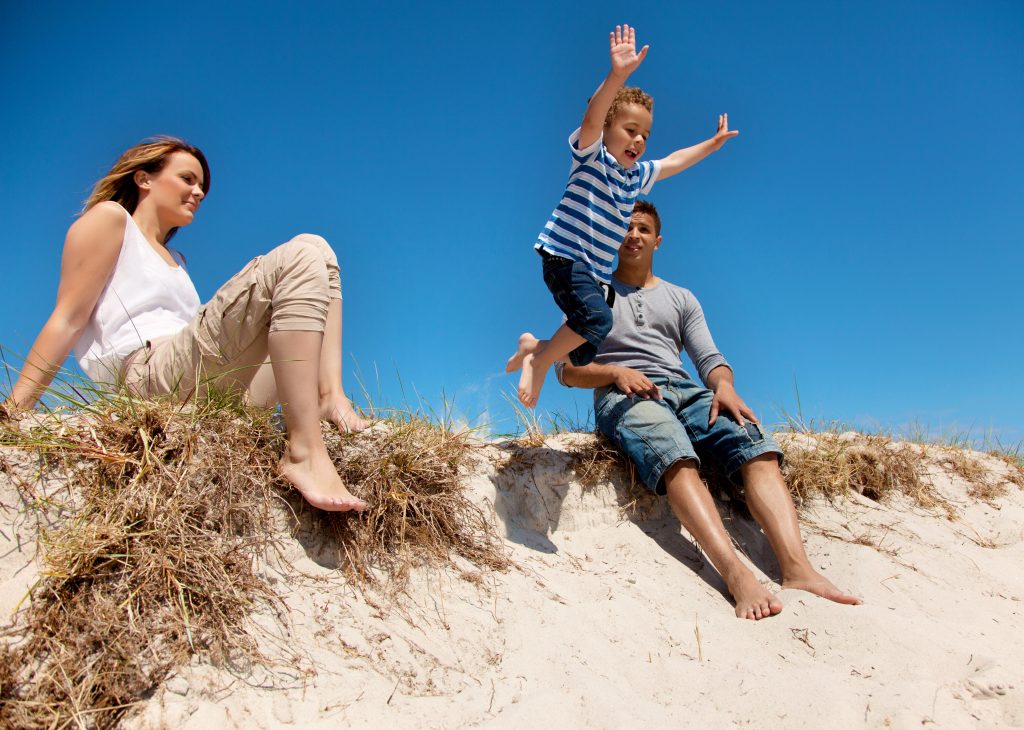 Sun, Salt, and Speed: Thrilling Water Sports to Try in Miami, FL 2 mixed race family enjoying their summer vacation outdoors BpA 1I4Yg