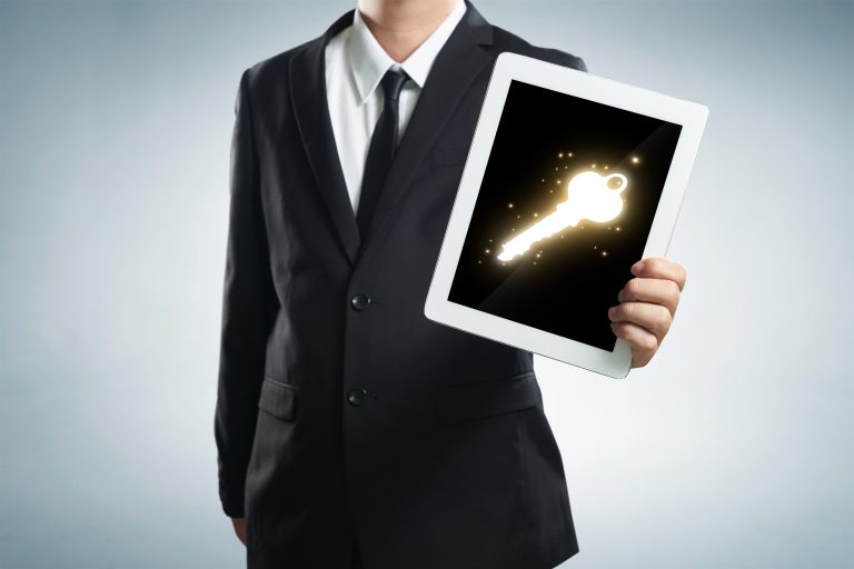 graphicstock-successful-young-businessman-shows-the-screen-of-the-tablet-with-key-to-success-symbo_rdab_jDeoe